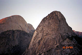 southern view at dusk of Liberty Cap and Half Dome (background, left)
