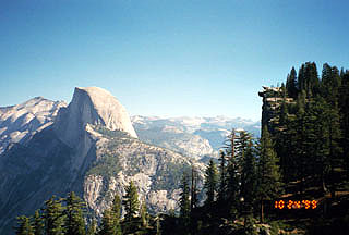 view of Half Dome and Glacier Point (jutting out from the cliff) viewed from the 4-mile trail